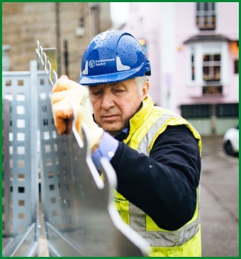 Field Services putting up the temporary flood barrier