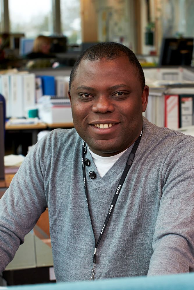 EA staff member smiling for a photo