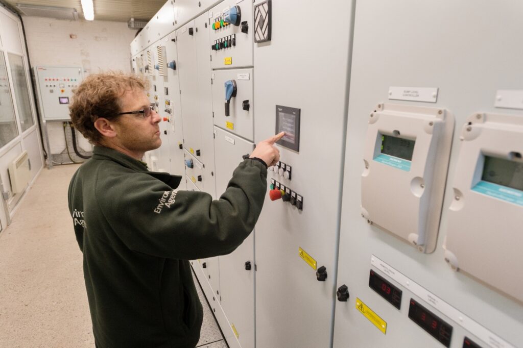 Staff member reviewing the controls