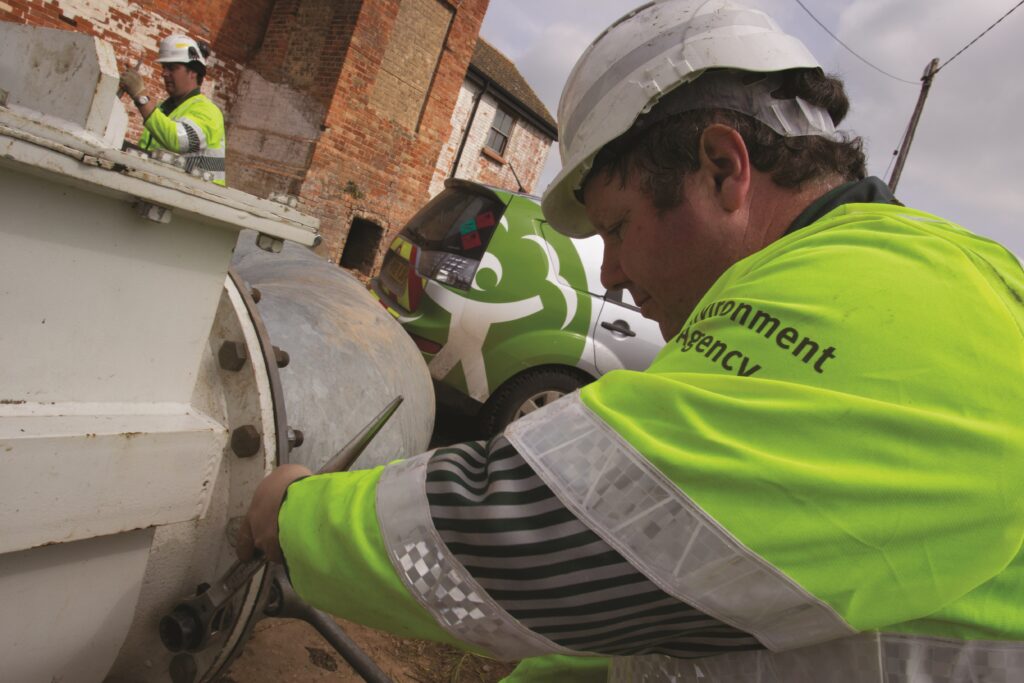 EA team member carrying out maintenance while wearing PPE