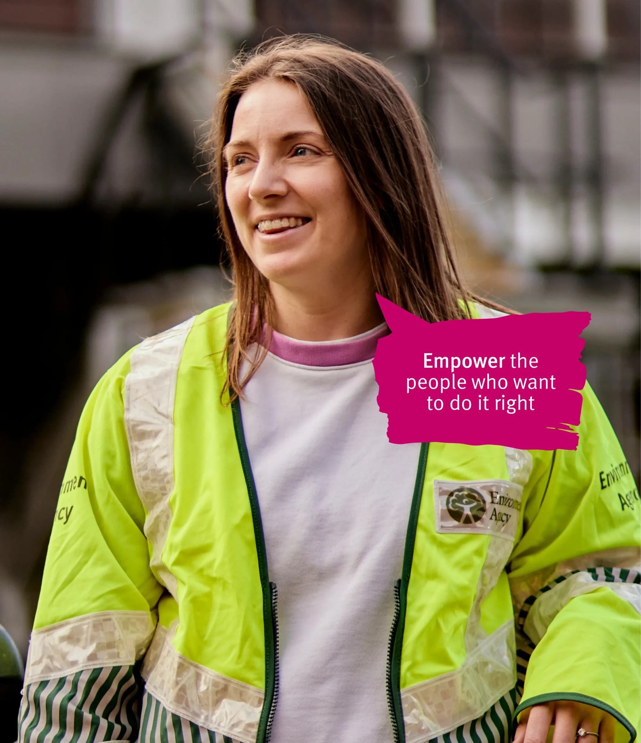 Women in green vest smiling